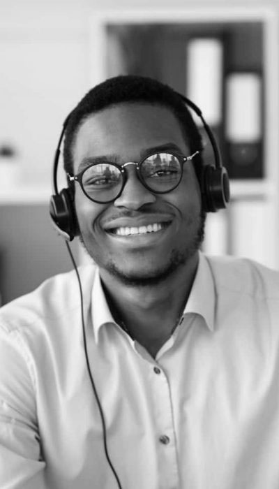 happy-black-consultant-with-headset-waving-at-came-20w